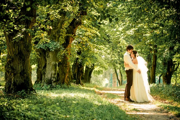 happy bride and groom on a walk in beautiful forest