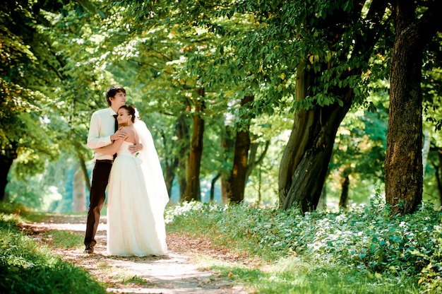 happy bride and groom on a walk in beautiful forest