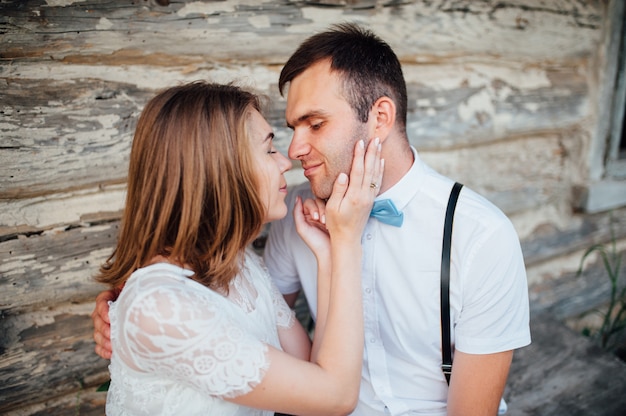 Happy Bride and groom walking on the green grass