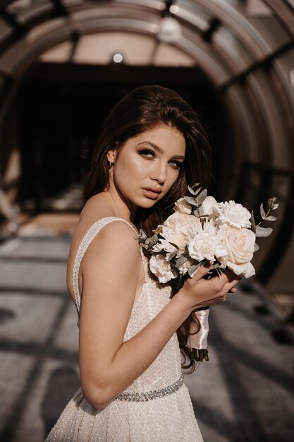 Happy bride with bouquet in tube