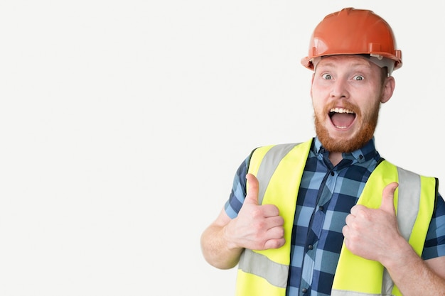 Photo happy builder in helmet on a white background