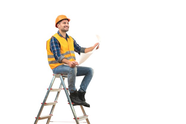 The happy builder with a paper sitting on the ladder on the white background