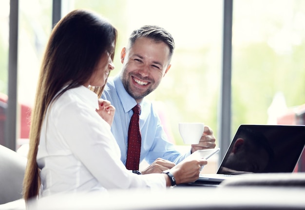 Happy business colleagues in modern office