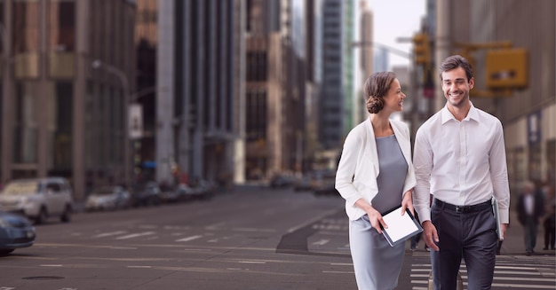 Happy business people walking at the city