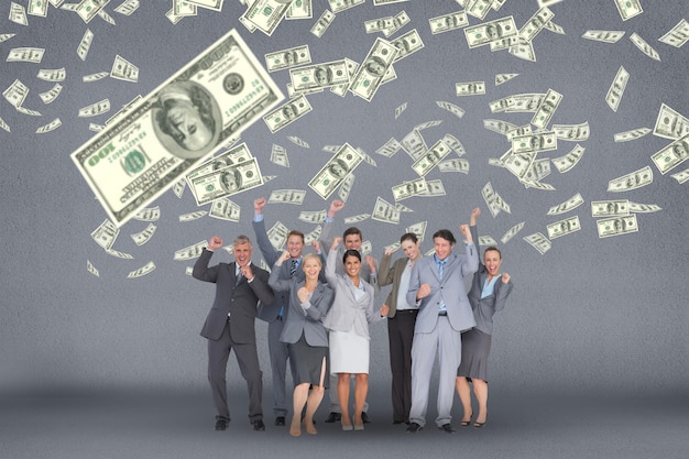 Photo happy business people with money rain against grey background