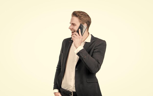 Happy business professional man in formalwear talk on mobile phone cellular communication