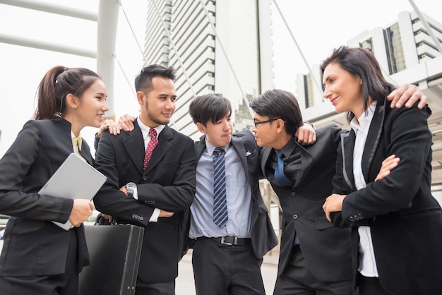 Premium Photo | Happy business team cheer up in town