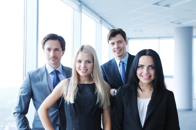 Happy business team of coworkers in office