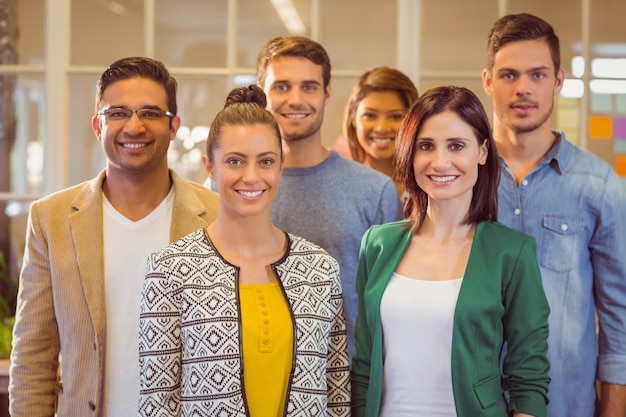 Happy business team smiling at camera