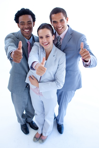 Happy business team with thumbs up