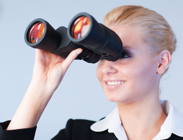 Happy business woman looking outwards