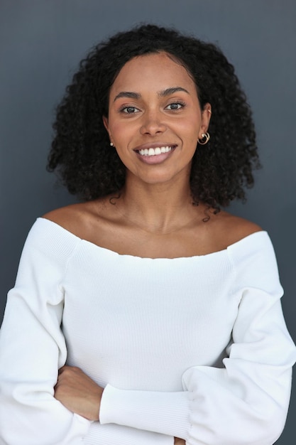 Happy business woman smiling inside office building