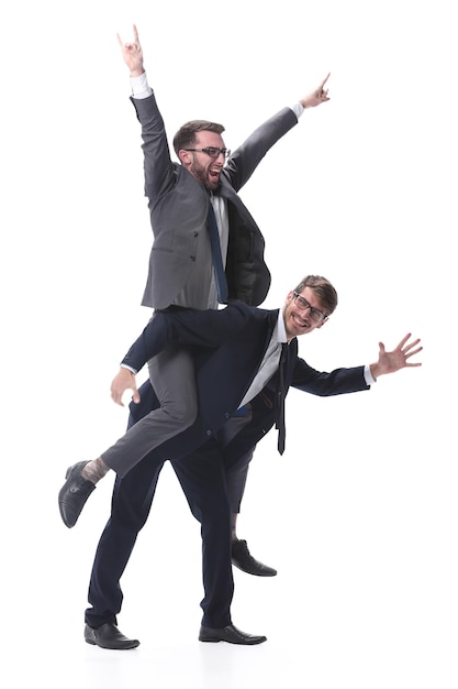 Happy businessman carrying his colleague on the piggyback