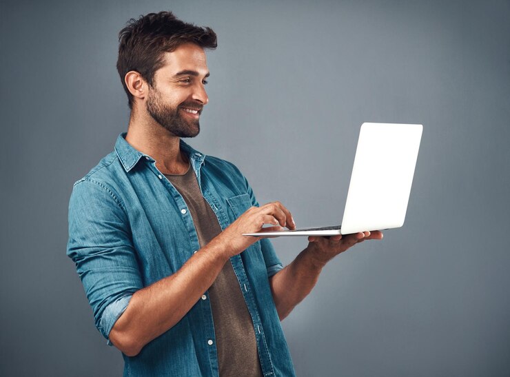 Photo happy businessman and laptop for video call or virtual interview for connection isolated in studio smile male person or employee and computer for networking in online meeting or conference