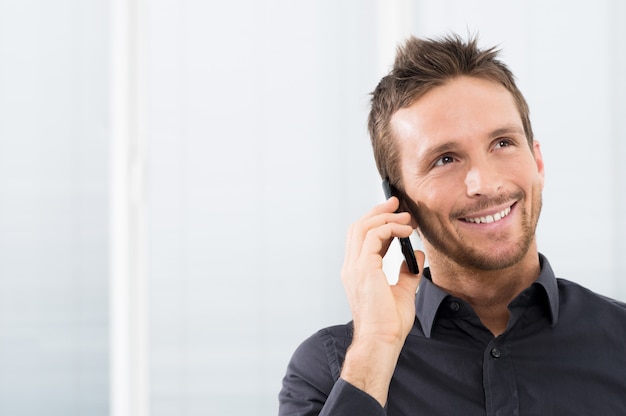 Happy Businessman On Mobile Phone