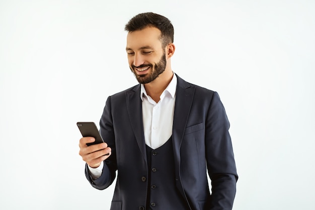 The happy businessman phones on the white background