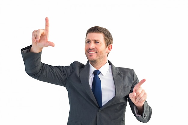 Happy businessman pointing with fingers