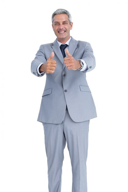 Happy businessman showing thumbs up