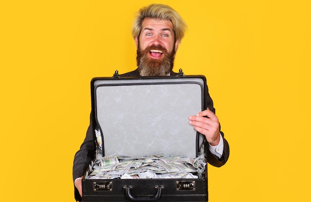 Happy businessman with briefcase full of money bearded man with case of dollars lending service