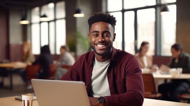 Happy Businessman Working in a Coffee Shop on his Laptop Computer