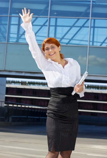 happy businesswoman in the city