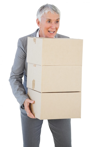 Happy businesswoman holding cardboard boxes 