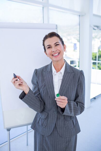 Happy businesswoman looking at camera 