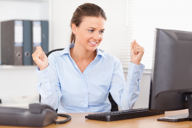 Happy businesswoman in an office