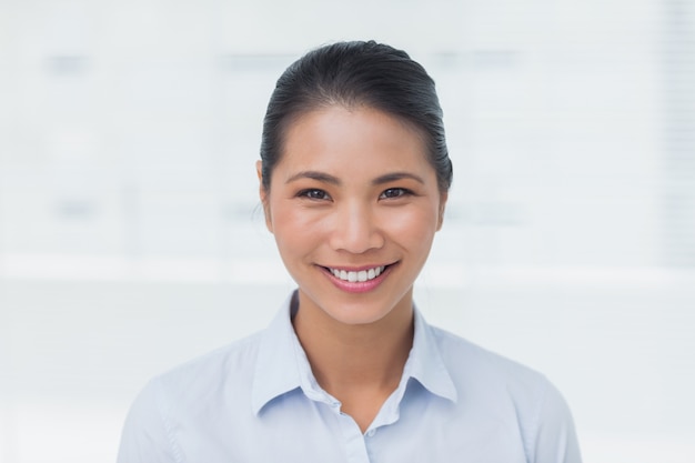 Happy businesswoman posing looking at camera