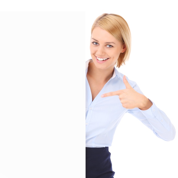 A happy businesswoman showing a banner over white background