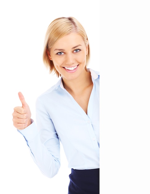 A happy businesswoman showing ok sign and holding a banner over white background