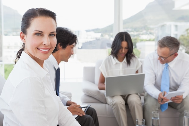 Happy businesswoman smiling at camera