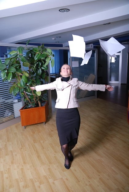 .happy businesswoman throwing documents