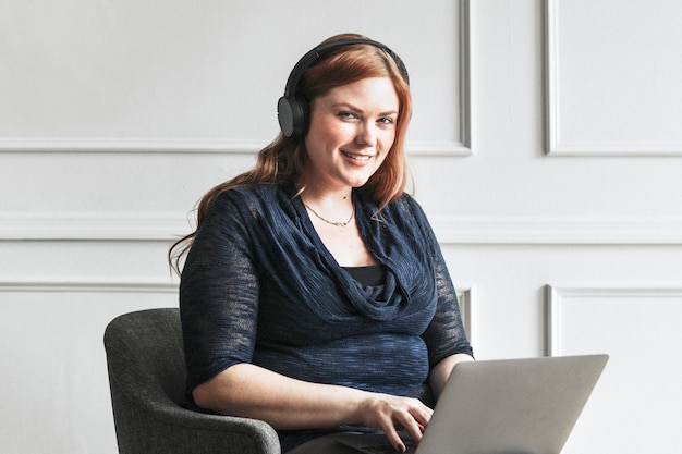 Happy businesswoman using a laptop