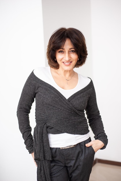 Happy businesswoman on white background