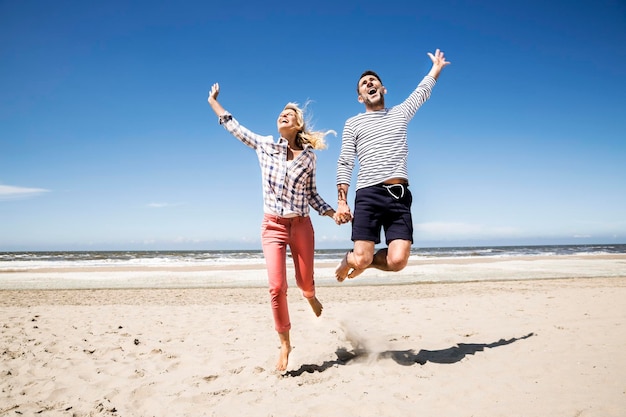 Happy carefree couple on the beach