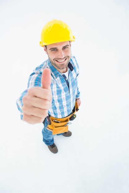 Happy carpenter showing thumbs up