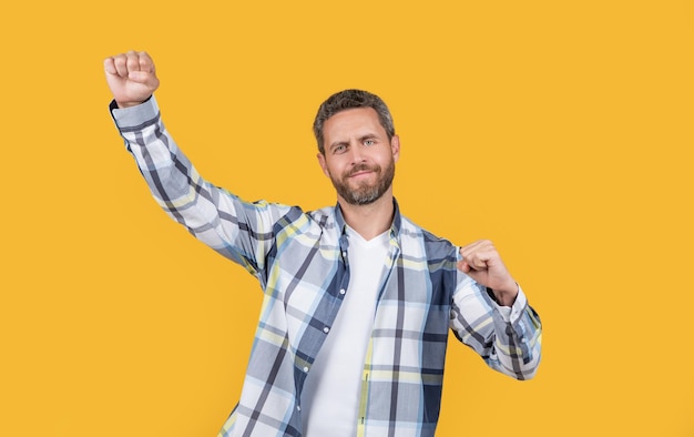 Happy casual man having fun in studio fun photo of caucasian man wear checkered shirt