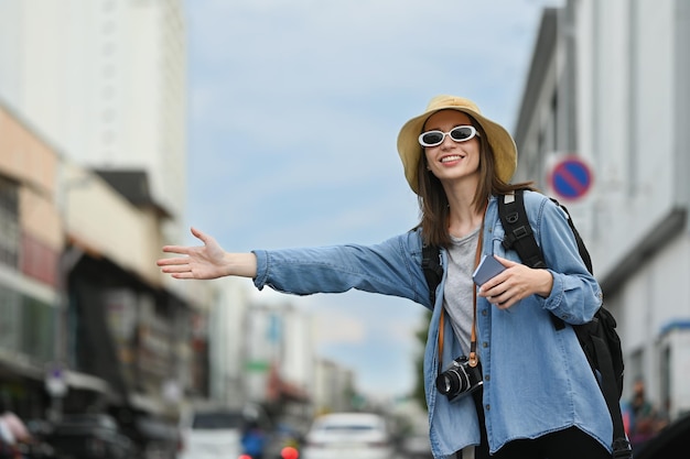 Happy caucasian female traveler with backpack on holiday vacation trip in Thailand Blogger vacation and journey concept