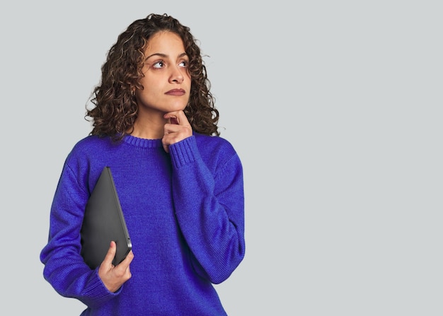 Happy caucasian woman searching on laptop