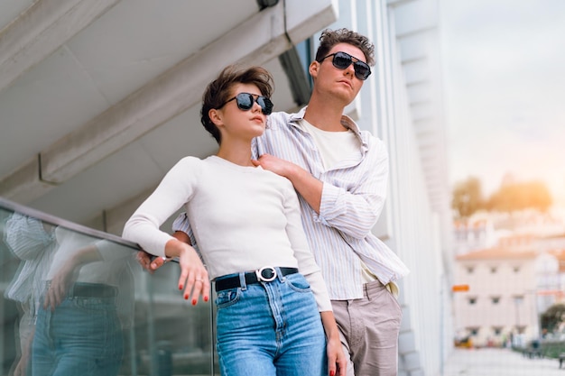 Happy cheerful couple in sunglasses