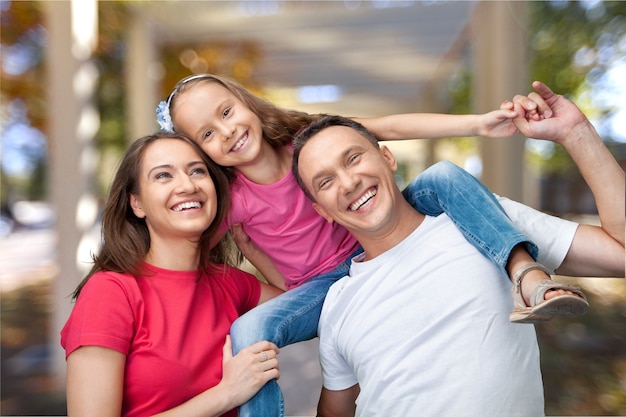 Happy cheerful family on background