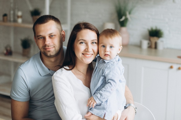 Happy cheerful young family at home