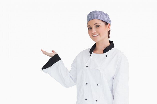 Happy chef showing something