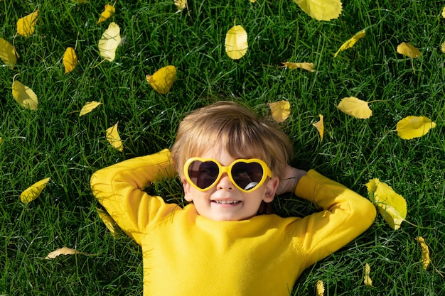 Happy child in autumn park