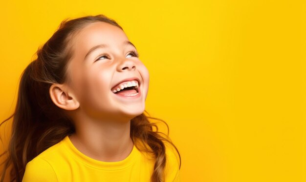 Happy child on a bright yellow background