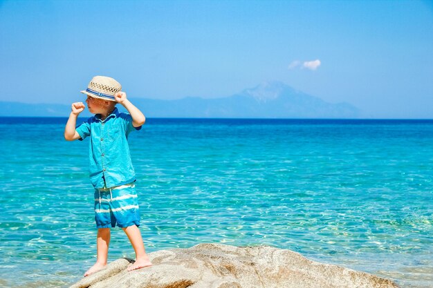 A happy child by the sea in nature weekend travel