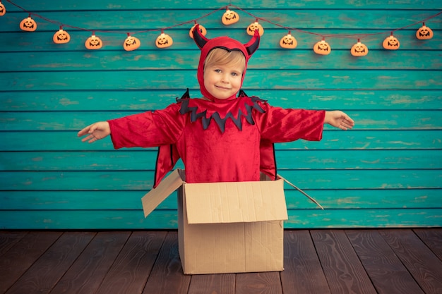 Happy child dressed Halloween costume