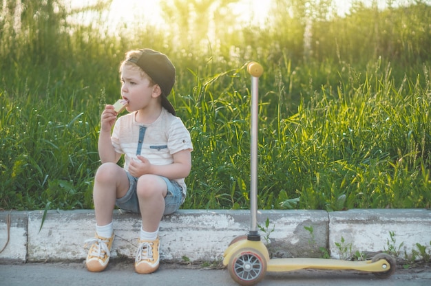 Happy child eating cookies outdoors