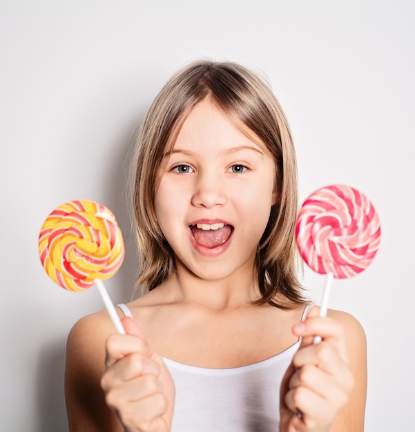 Happy Child Girl Holding Lollipops